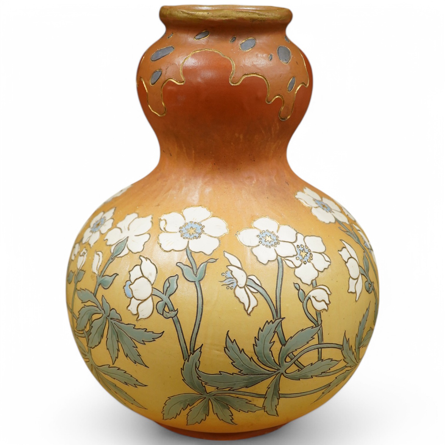 A Mettlach stoneware floral vase, impressed marks, 36cm high. Condition - fair/good